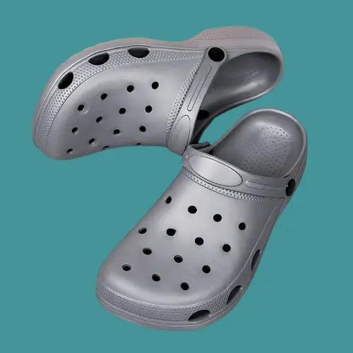 Gray unisex CrocsOrtho clogs with breathable design and non-slip sole for comfort and style.