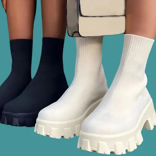 BootyComfort Women’s Casual Fashion Sneakers in black and white displayed with a stylish bag.